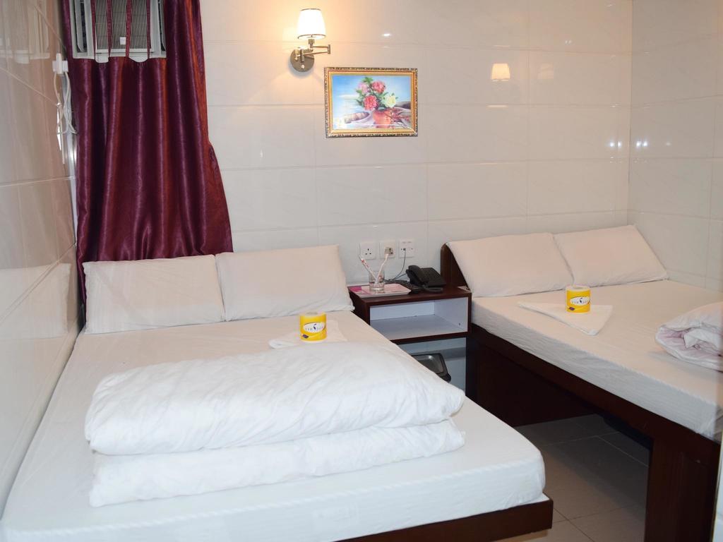 Om Guest House Hongkong Rom bilde